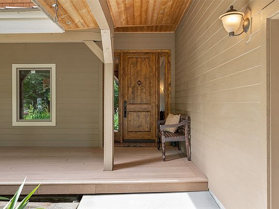 A beautiful 12 foot  front door that opens to a bounty of craftmanship and open living space just waiting for you to come enjoy.>