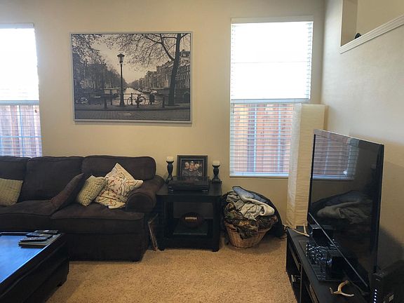Living room TV area with large sectional
