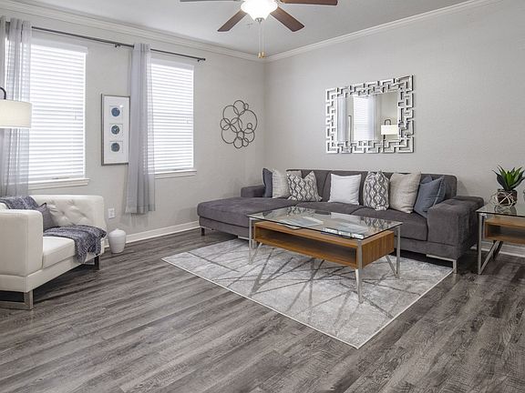 Cozy Living Room with Stylish Sectional Sofa and Statement Mirror