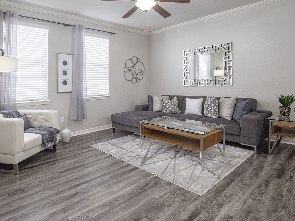 Cozy Living Room with Stylish Sectional Sofa and Statement Mirror