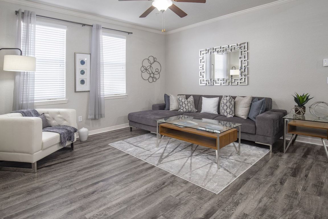 Cozy Living Room with Stylish Sectional Sofa and Statement Mirror