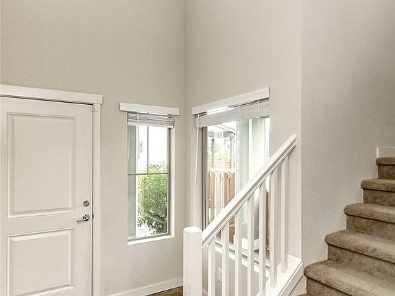 Tall vaulted entrance sets off the new entry chandelier! It's perfect!