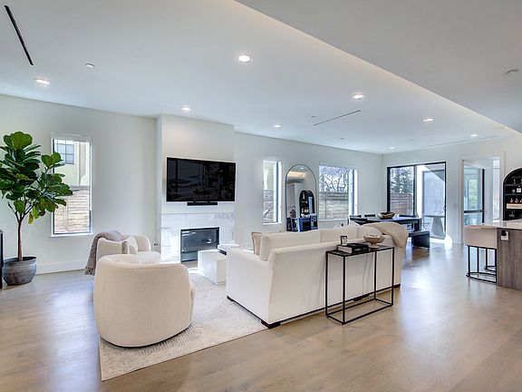 Open floor plan flooded with natural light.