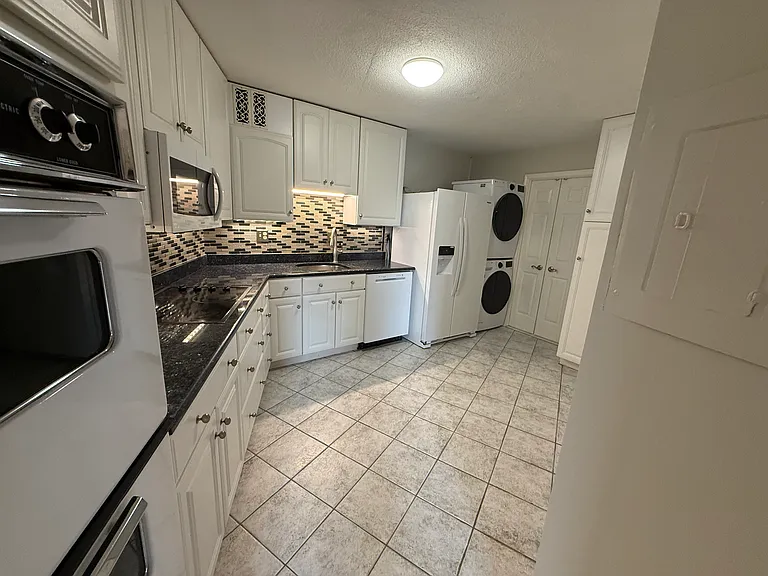 Spacious kitchen with ample counter space and cabinets for storage