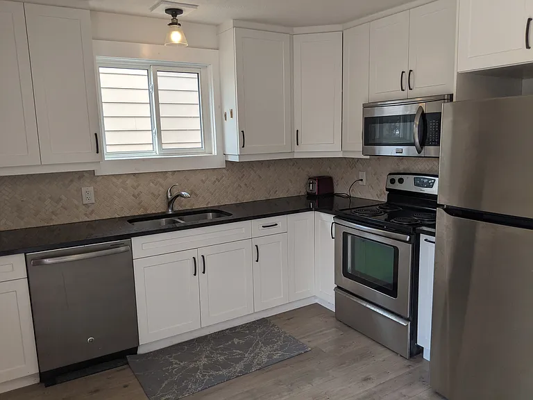 Kitchen has tons of storage and food prep space and is fully equipped with SS Appliances.