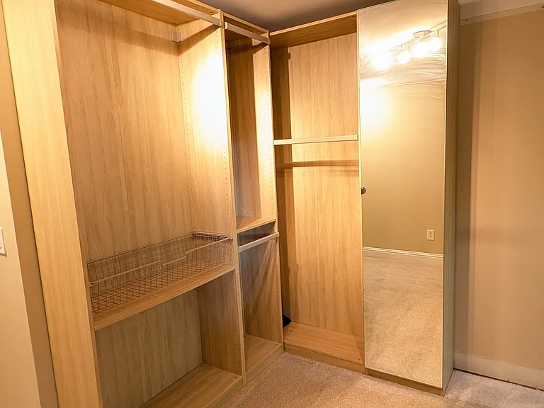 Customizable closet system at the end of the second floor hallway.