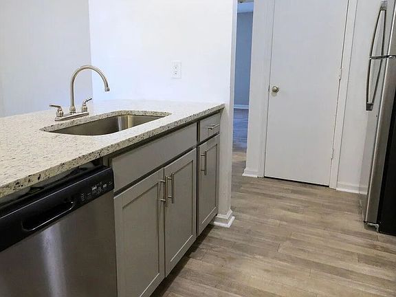 Granite Counters and Sleek Designer Cabinets