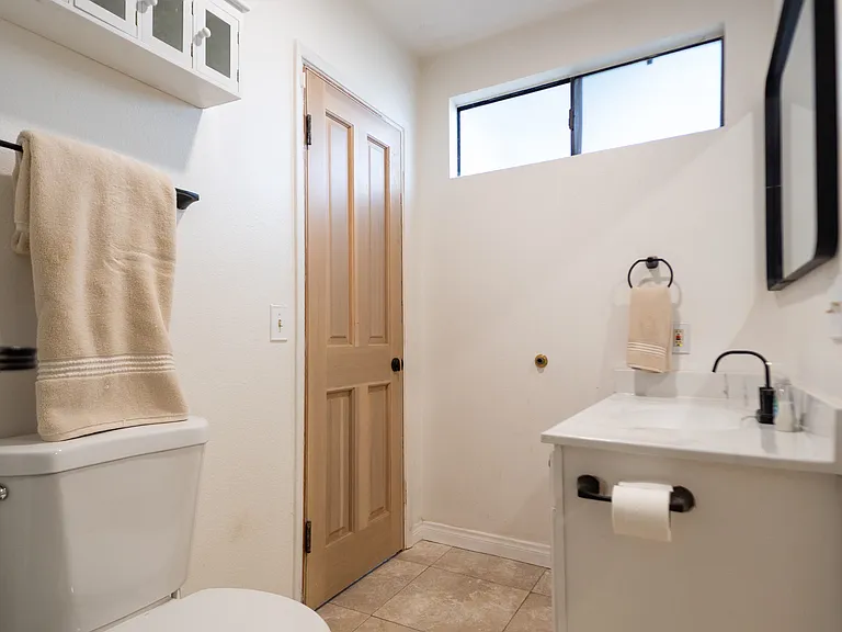 bathroom with access to small private patio