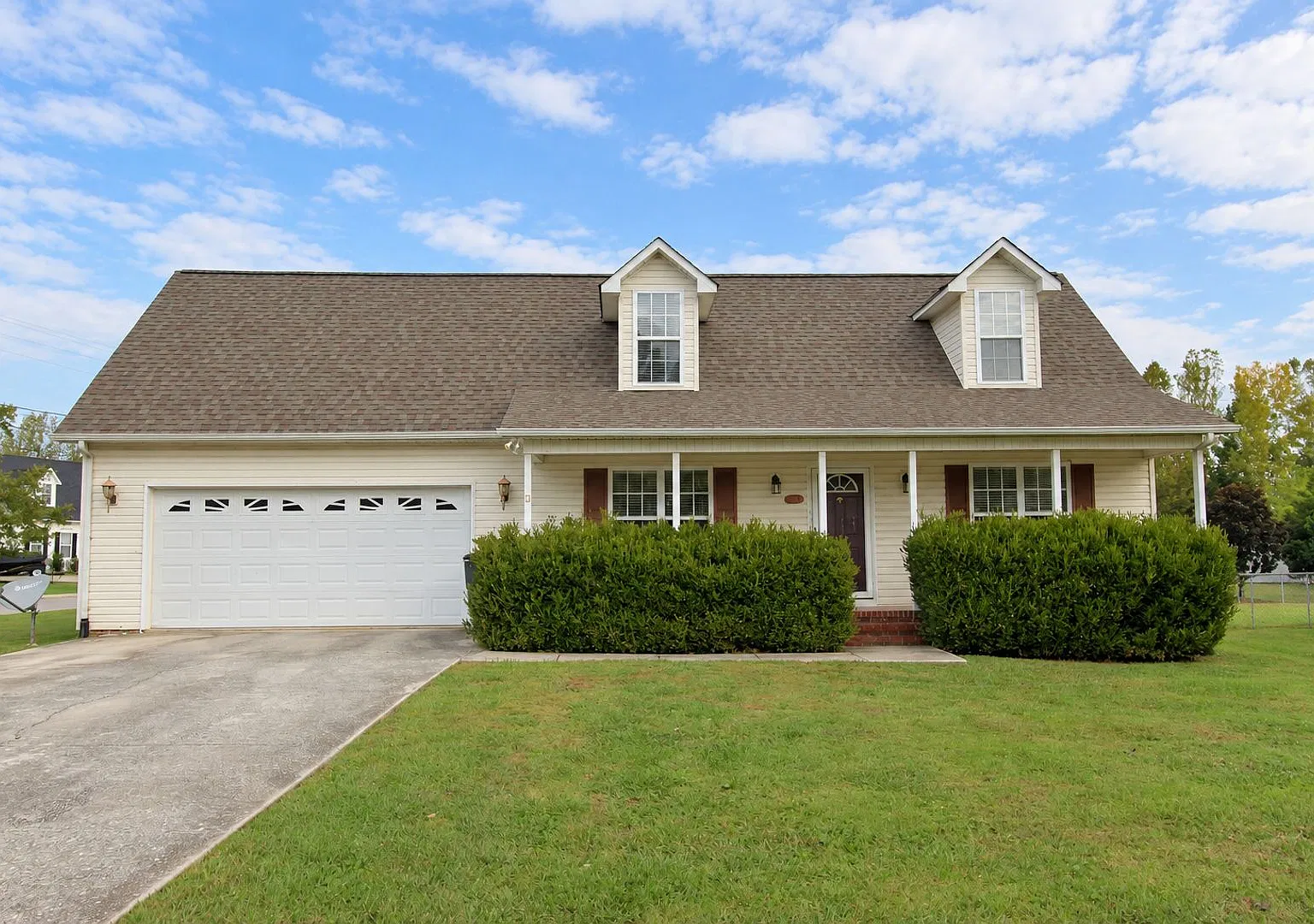 3-Bedroom Home with Main-Level Primary Suite, Sunroom & 2-Car Garage — Photo 1