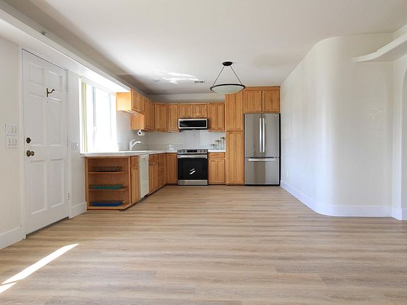 Standing in Family Room and facing kitchen and dining area.