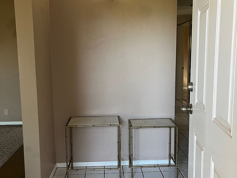 Stepping inside entryway; hallway on right and living room, dining, bonus room on left.