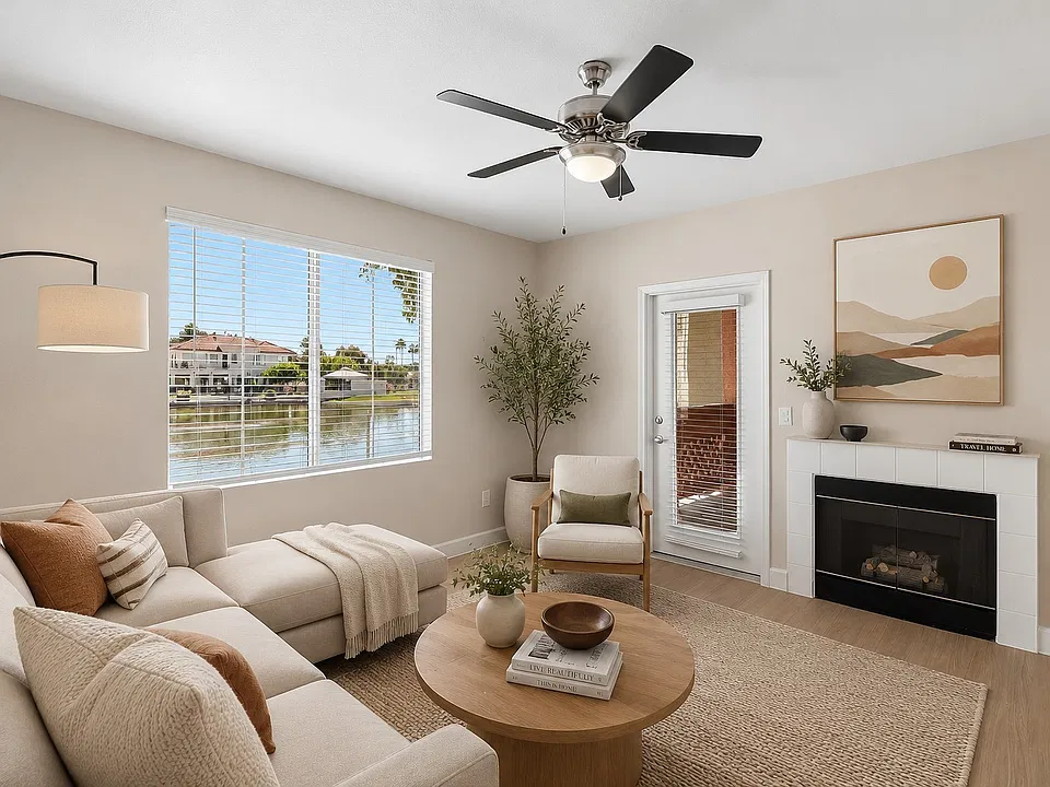 Step into the inviting living space at Serena Shores, where natural light dances through large windows, highlighting contemporary design and serene water views. Embrace comfort and styleschedule your visit today to explore your new home!