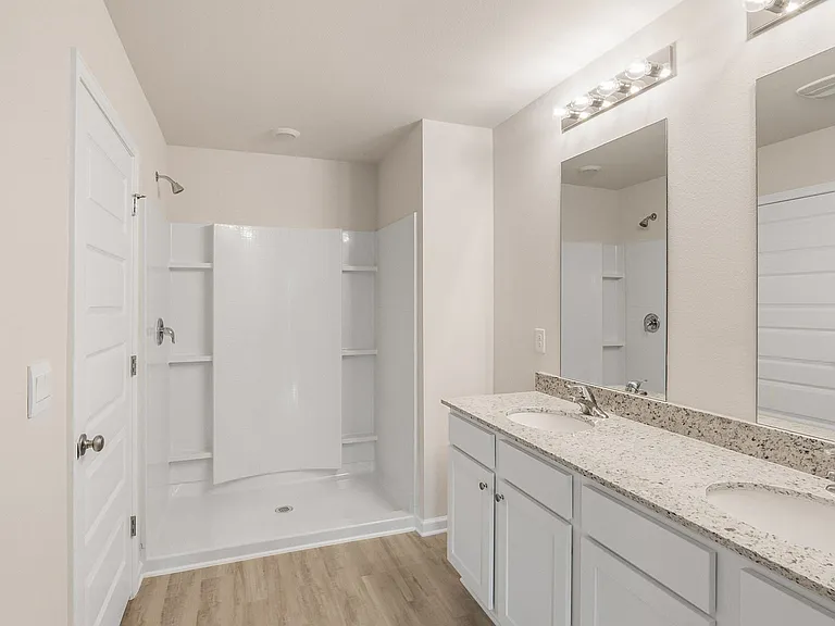 Master bath with linen closet and walk-in closet.