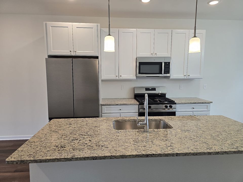 Kitchen with brand new stainless steel appliances and latest cabinetry with soft close