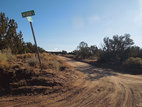 Encanto road leading to lot