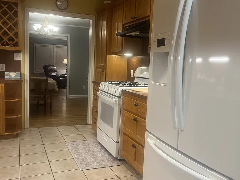 Kitchen _ full-size refrigerator and gas range