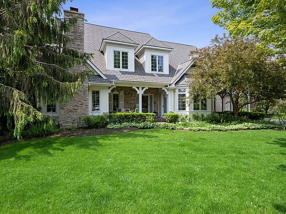 Professionally landscaped with mature trees and gardens galore!