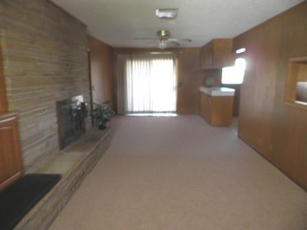 Family Room w/ fireplace and bookcases