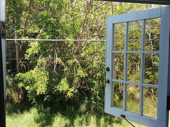 Both bedroom windows upstairs open out to quiet, peaceful and safe Paseo de Pesca adjacent to Reserva Natural Punta Cucharas, and Playa Solace Beach about 150 feet from the house.