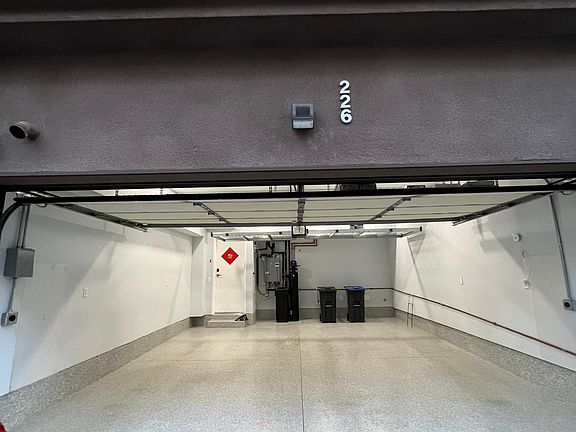 Epoxy flooring, overhead racks, tankless water heater, water softener, 2 EV chargers (25 Amp each)