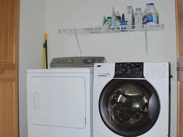 Shared laundry - in hallway (normally hidden by folding doors)