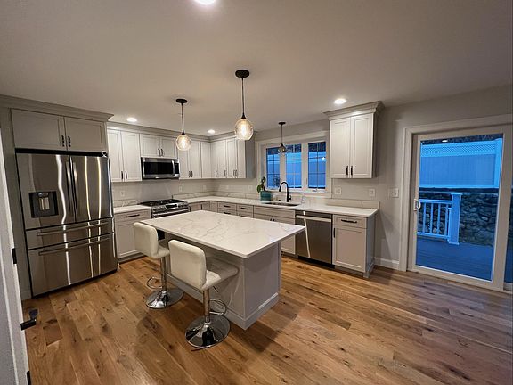 kitchen with large island. Walk out the sliding doors to the back deck
