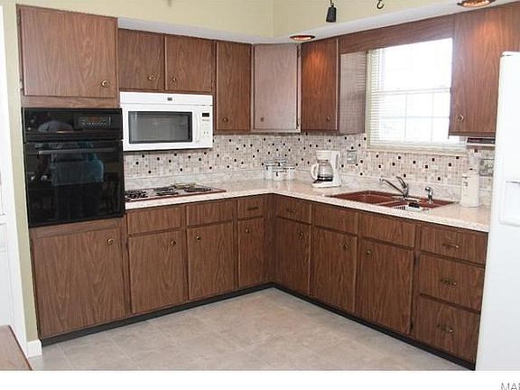 Check out this kitchen - some of it is original and so well maintained you will think it's brand new.   Appliances upgrades and conveniences have been added - you will be amazed at how large it is when you see it in person!
