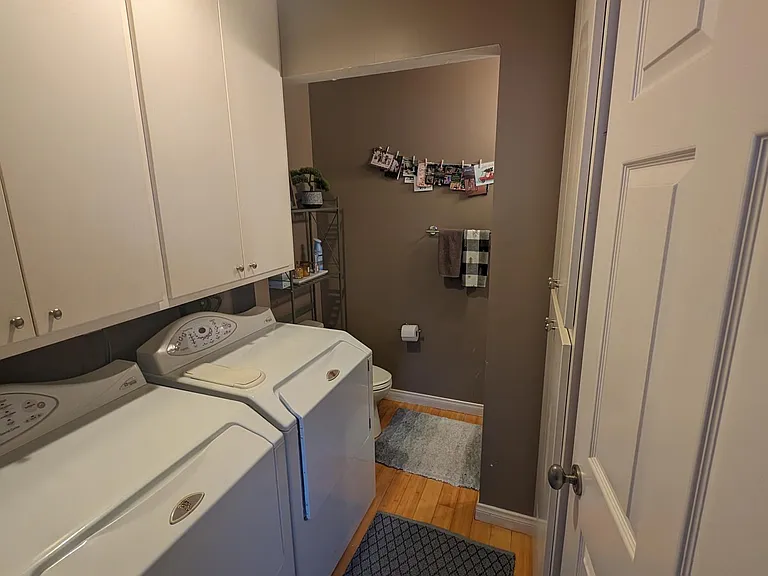 The laundry room and half bath located in the lower level.