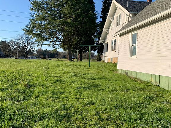 side yard. You can faintly see a line between the hay field and the yard that is the tenant line. lol