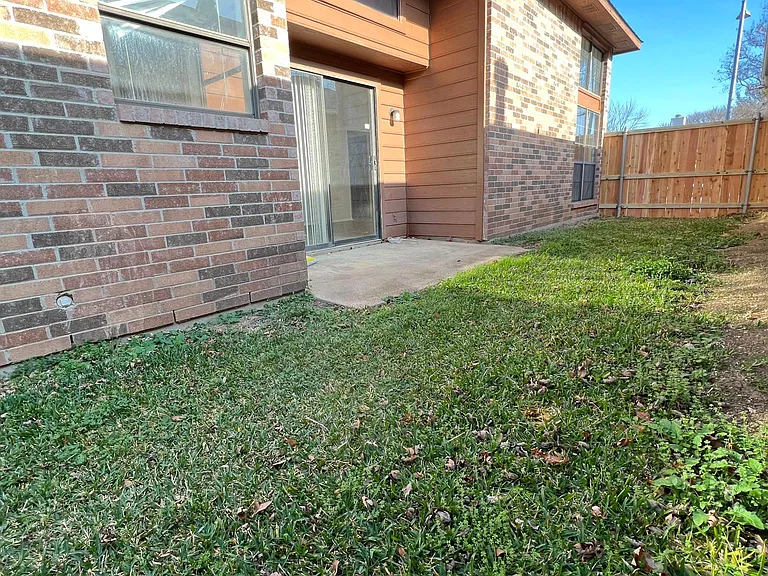 Sliding door to fenced backyard