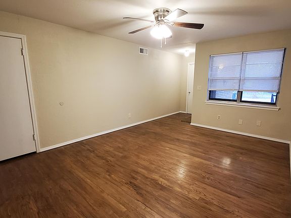 refinished wood floor in living room