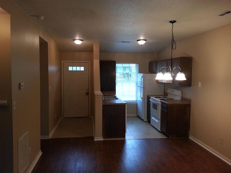 Tile entrance and kitchen. Hardwood tile Living room. (This is similar photo of kitchen)