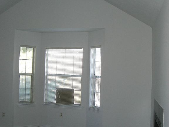 Living room with high ceiling and bay window