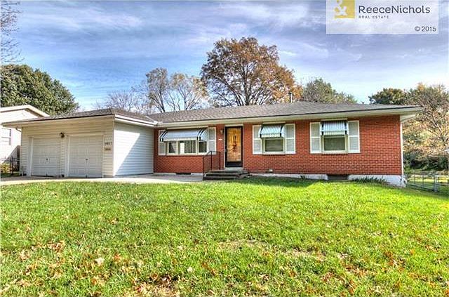 Sherwood Estates' true ranch with steel siding and brick trim