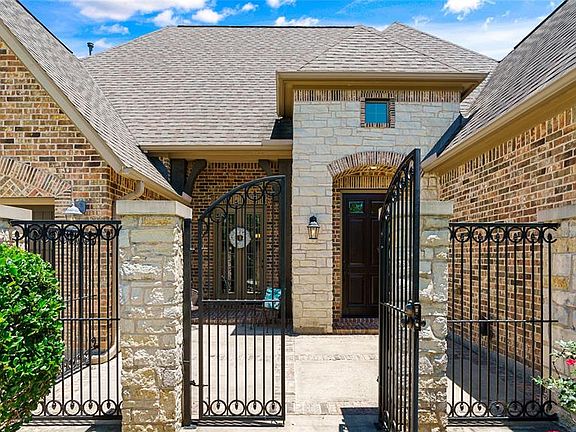 In a neighborhood of well-maintained executive homes, this attractive entry welcomes your family and friends.