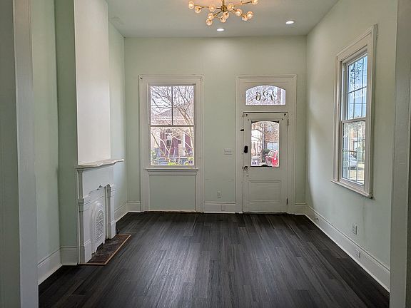 Living room with high ceiling and plenty of light
