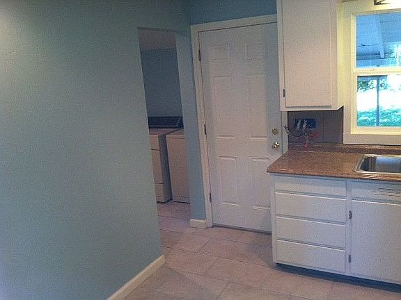 Kitchen looking into Laundry