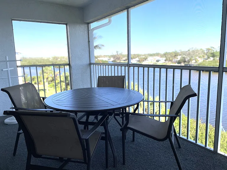 Screened lanai overlooking large lake
