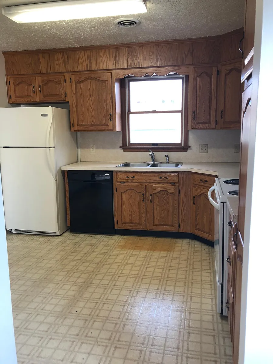 Kitchen includes dishwasher, refrigerator and stove. This flooring will be replaced with LVP - 70 Brookmeadow Ln