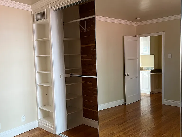 TRIPLE MIRROR CLOSET: DOUBLE HANG & SHELVING INSIDE CLOSET TO LEFT (PLUS WALL BOOK CASE).