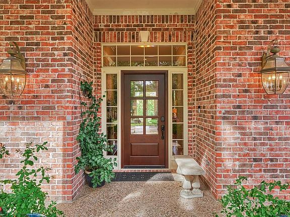 The current homeowners have added a beautiful mahogany door with glass.