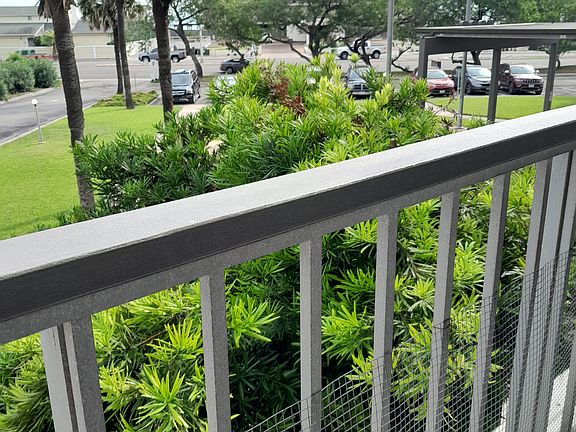 Balcony picture showing ocean drive view: have beach to bay and all other items Right in front of you/
