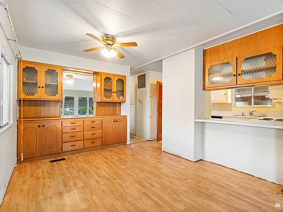 Dining area with built-in cabinets >