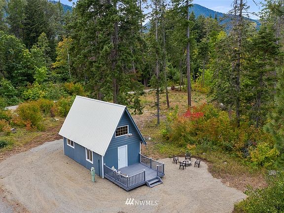 Aerial shot of the cabin and firepit. The newly installed septic is to the right of the back side of the cabin.