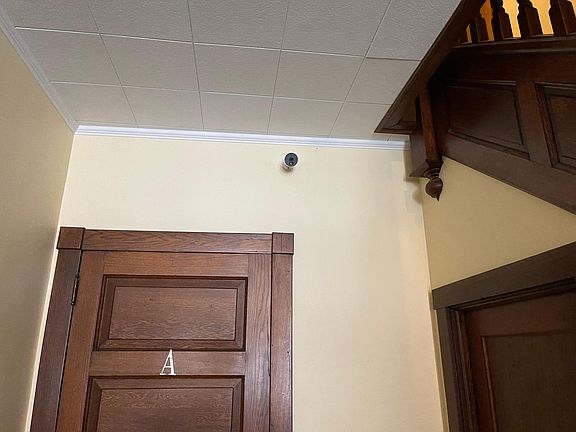 Security camera in downstairs hallway