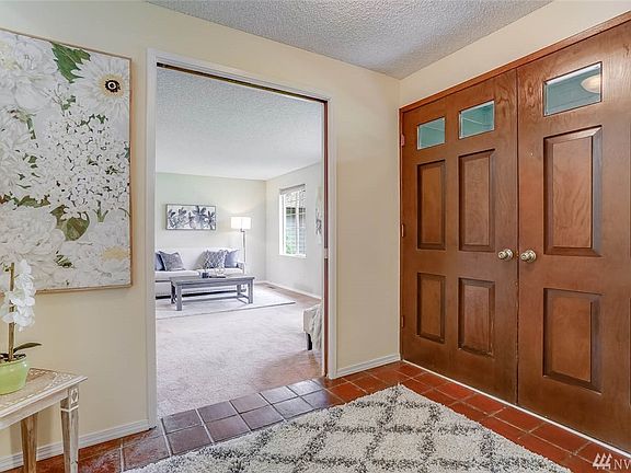 Double doors enter to a spacious tiled foyer. 