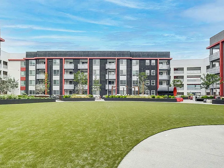 Griffis Platinum Triangle outdoor park with grassy lawn.