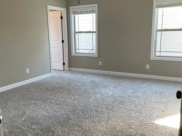 Master Bedroom. The Master Bathroom is the left door in the photo. The Master Closet will be on the right side of the photo.