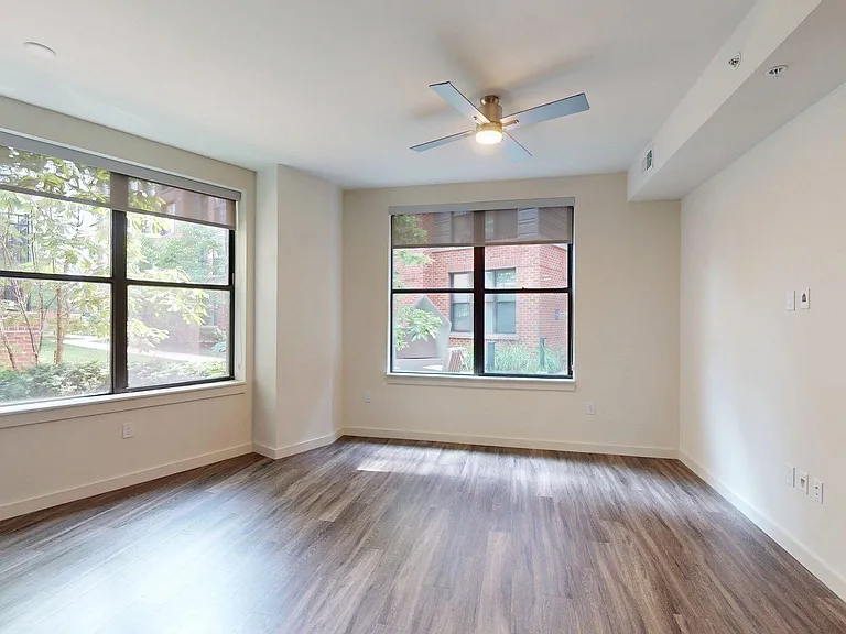 Apartment living room with wood-style flooring.