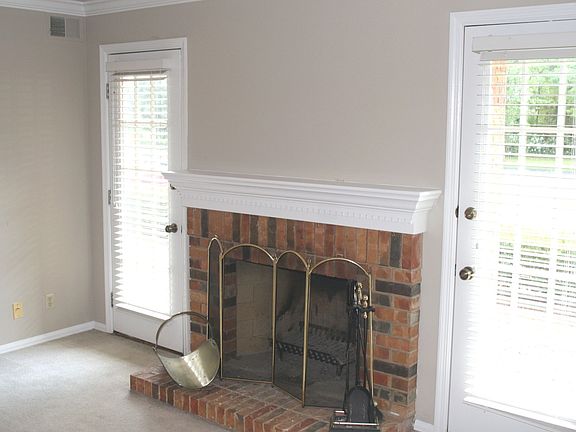 Living Room w/French Doors Flanking the Fireplace! 